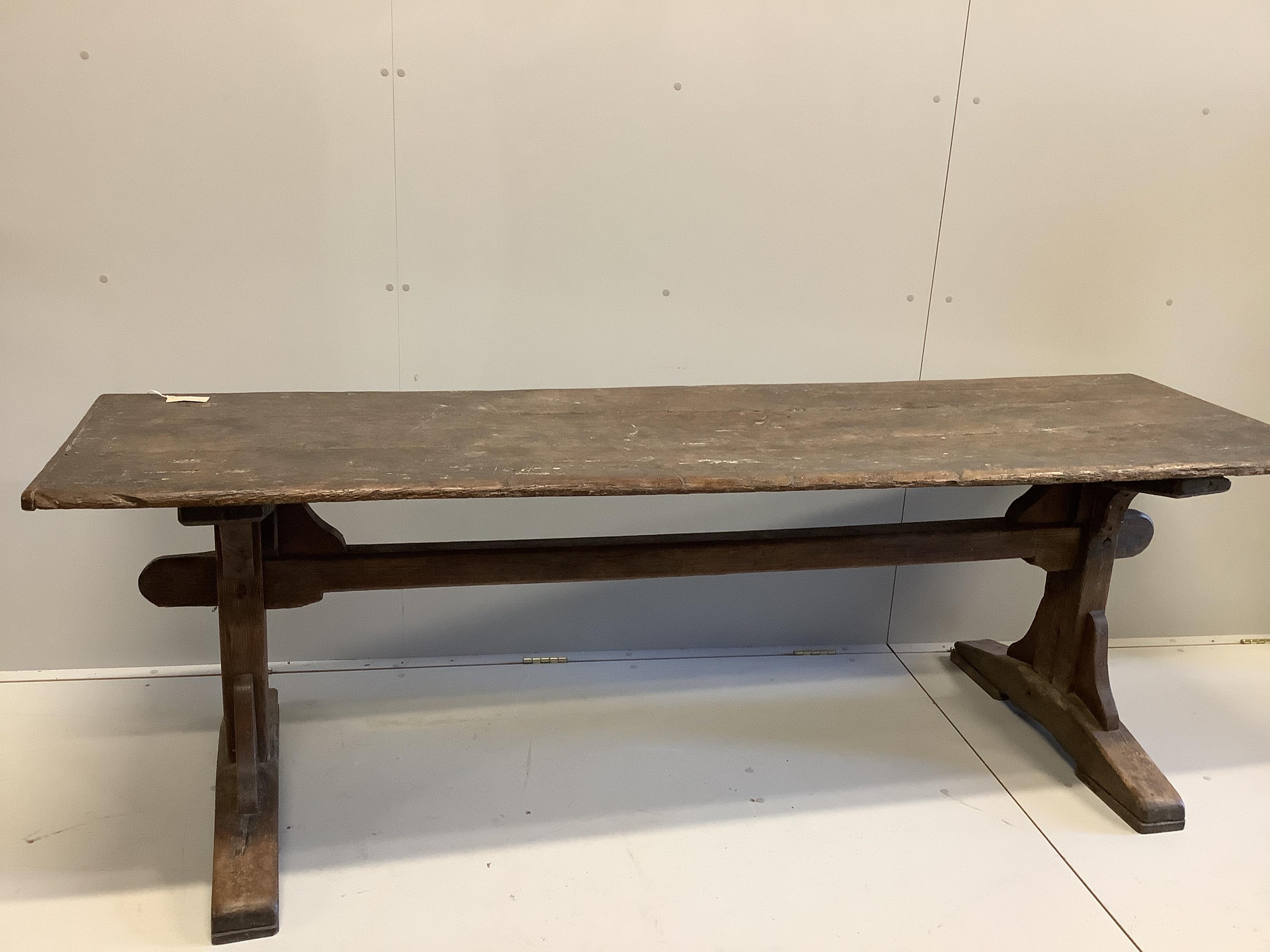 An 18th century and later rectangular oak plank top refectory table, length 226cm, depth 66cm, height 72cm